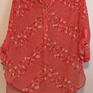 Sheer melon colored blouse with flowers in deeper colored melon, red & white.